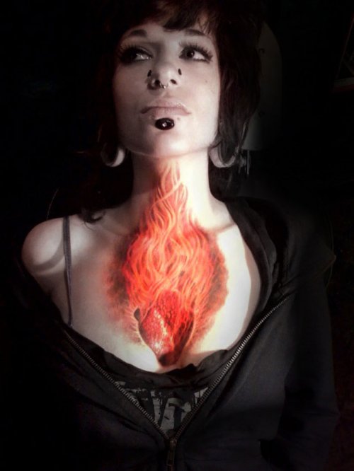 Red Ink Flaming Heart 3D Tattoo On Girl Chest