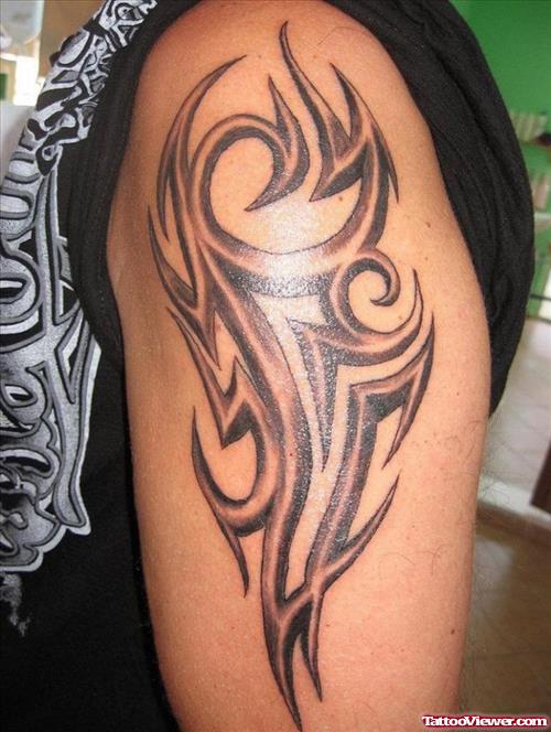Grey Ink Tribal African Tattoo On Hlaf Sleeve