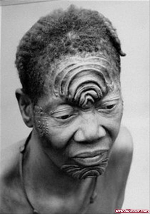 African Tattoo On Face
