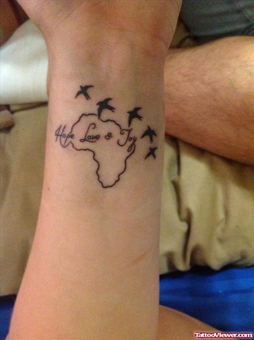 Flying Birds And African Tattoo On Wrist