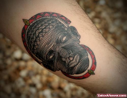 African Mask Tattoo On Arm