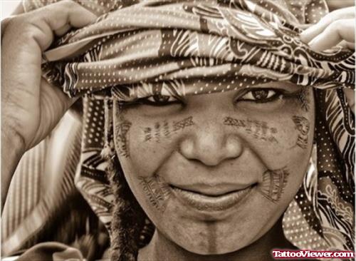 Lady With African Tattoos On Face