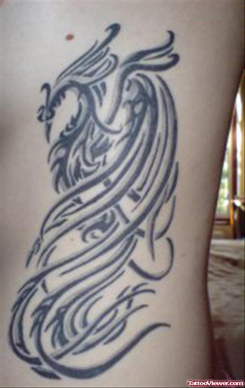 African Trinal Phoenix Tattoo On side Rib