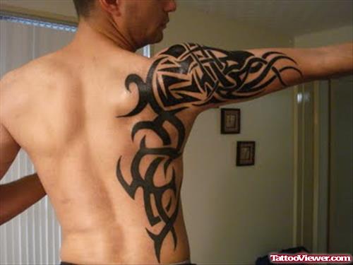 African Tribal Tattoo On Back And Right Sleeve