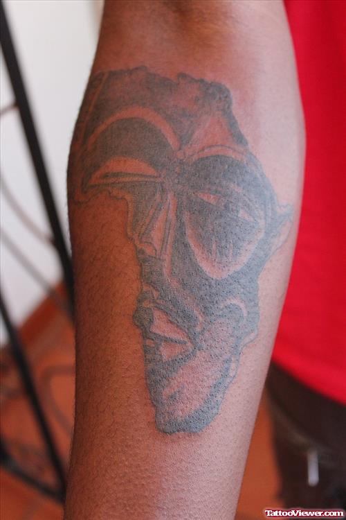 African Mask In Map Tattoo On Sleeve