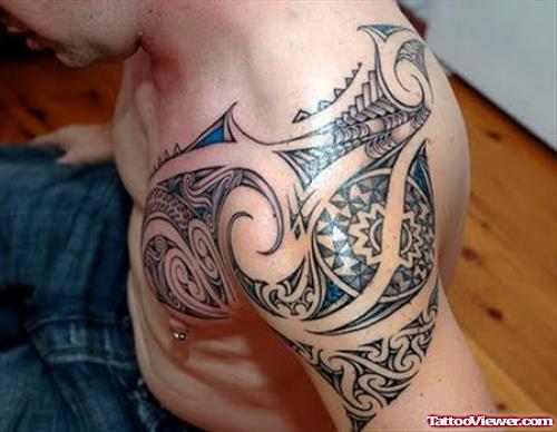 African Tribl Tattoo On Man Left Shoulder