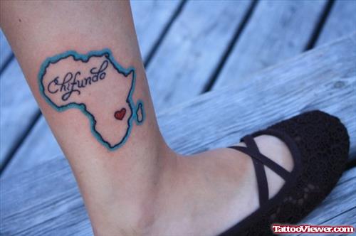 African Map With Tiny Red Heart Tattoo On Right Leg