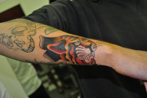 Man Right Arm African Tiger Face Tattoo