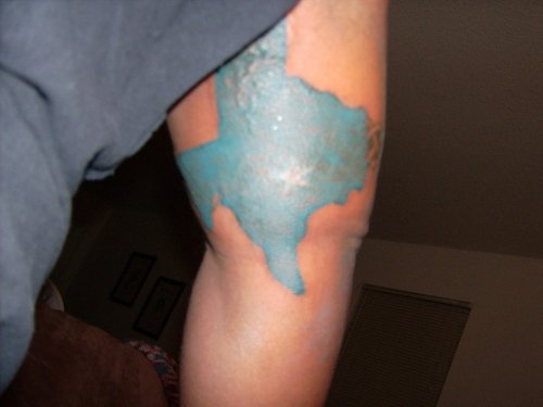 Blue Ink Texas Map Tattoo On Half Sleeve