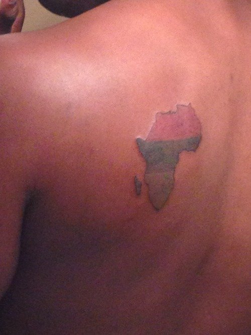 Colored African Map Tattoo On Back Shoulder