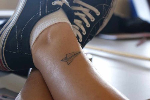 Small Paper Plane Tattoo On Leg