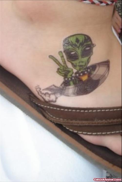 Green Alien In Spaceship Tattoo On Foot