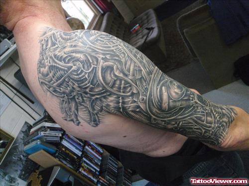 Grey Ink Biomechanical Alien Tattoo On Right Half Sleeve