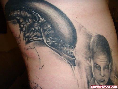 Grey Ink Alien Tattoo On Man Side Rib
