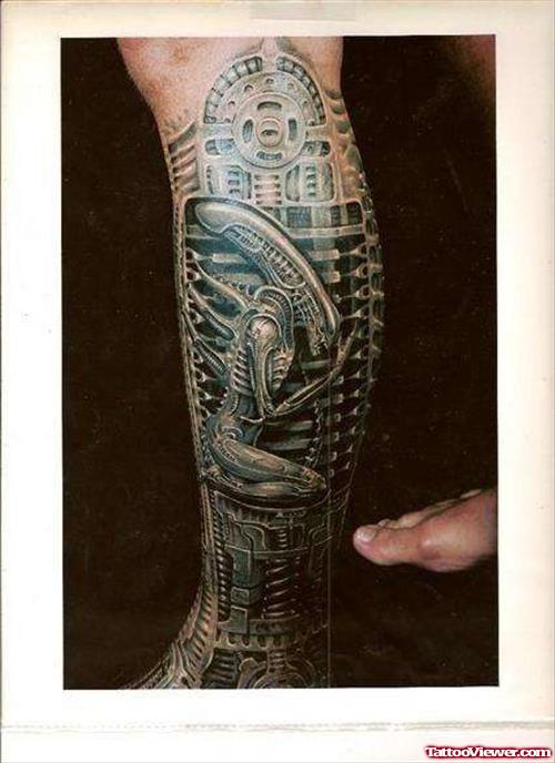 Grey Ink Biomechanical Alien Tattoo On Leg