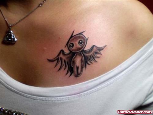 Winged Alien Tattoo On Girl Chest