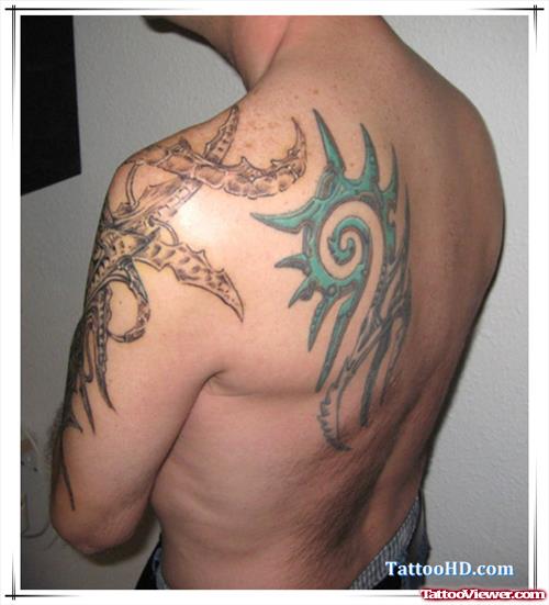 Tribal Alien Tattoo On Back And Left Shoulder