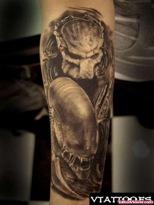 Grey Ink Alien Vs Predator Tattoo On Arm