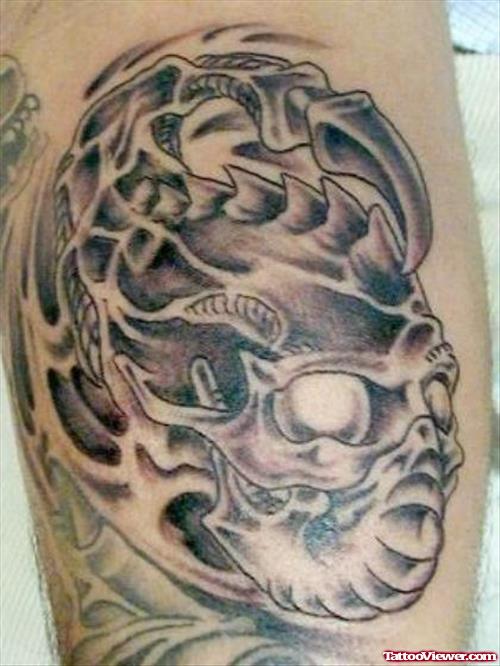 Grey Ink Bicep Alien Tattoo