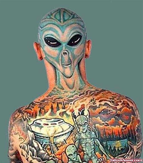 Colored Ink Alien Tattoo On Man Head And Upperback
