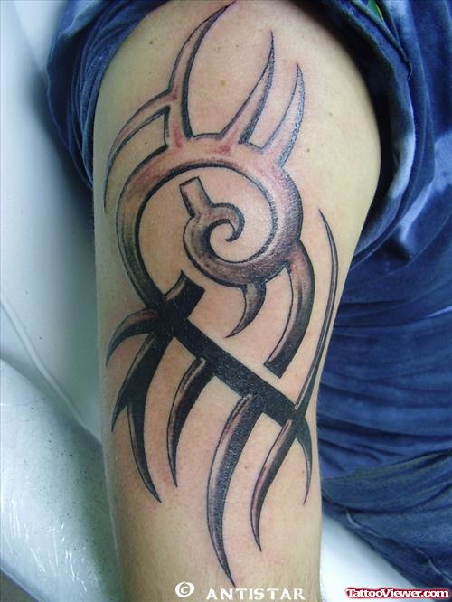 Grey Ink Tribal Alien Tattoo