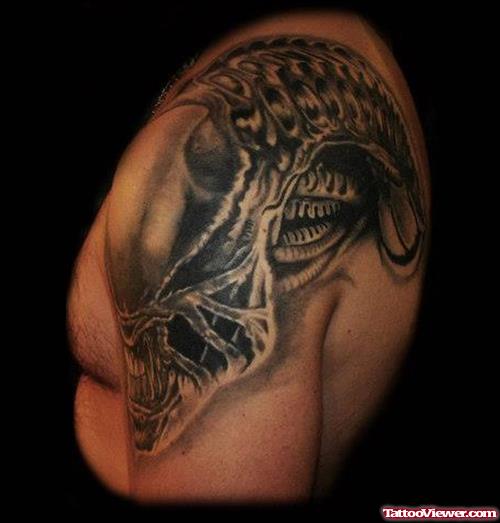 Grey Ink Alien Tattoo On Man Left Shoulder