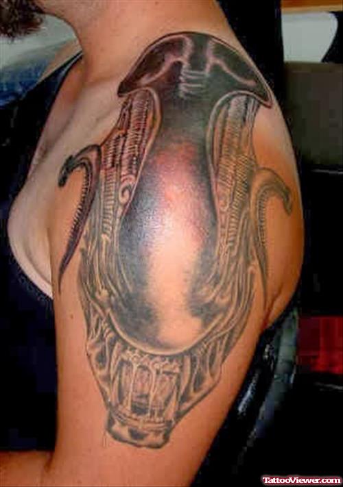 Grey Ink Alien Tattoo On Left Shoulder
