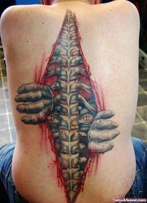 Alien Spinal Cord Tattoo On Back