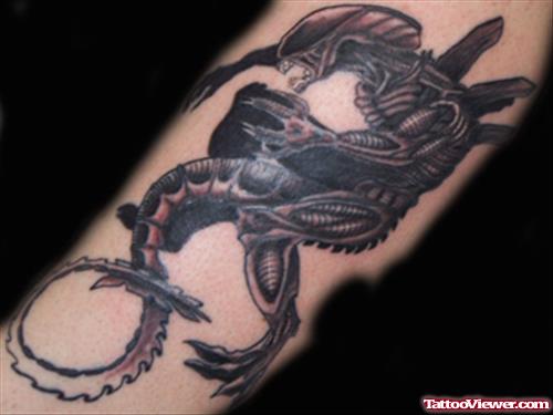 Grey Ink Alien Tattoo On Arm