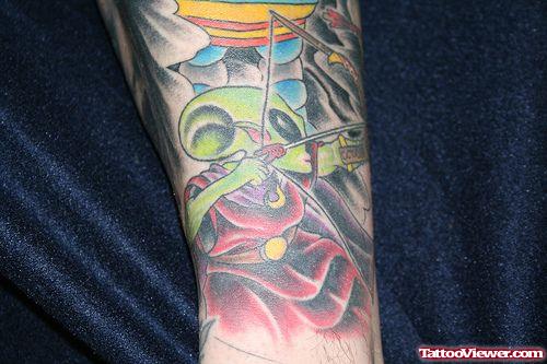 Colored Ink Alien With Bow And Arrow Tattoo