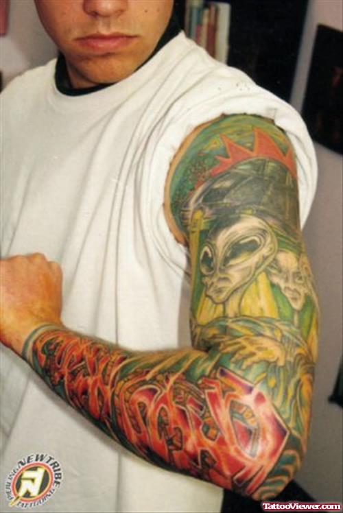 Colored Ink Alien Tattoo On Left Sleeve