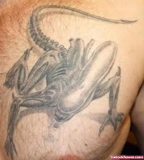 Grey Ink Alien Tattoo On Chest