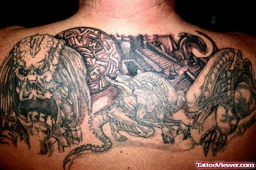 Grey Ink Alien And Predator Tattoos On Upperback