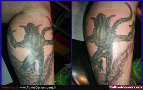Green Ink Alien Tattoo On Leg