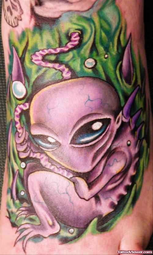 Colored Ink Alien Tattoo On Left Foot
