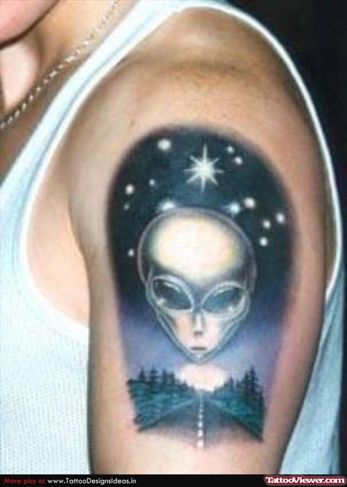 Beautiful Color Ink Alien Head Tattoo On Man Left Shoulder