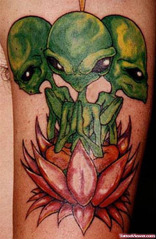 Green Aliens In Lotus Color Ink Tattoo