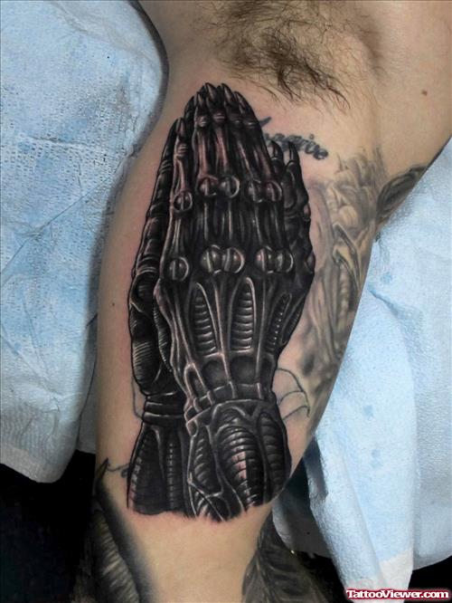 Alien Praying Hands Tattoo On Muscles
