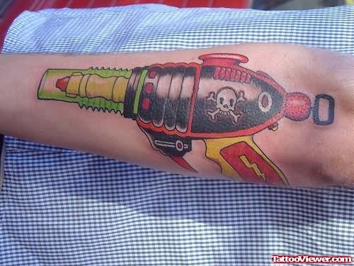 Alien Gun Tattoo On Arm