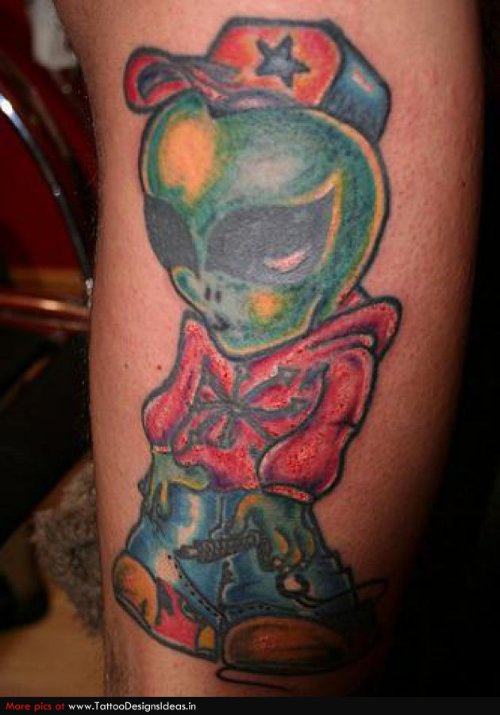 Colored Ink Alien Tattoo On Leg