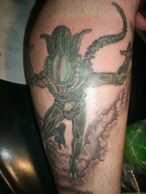 Awesome Green Ink Alien Tattoo On Leg