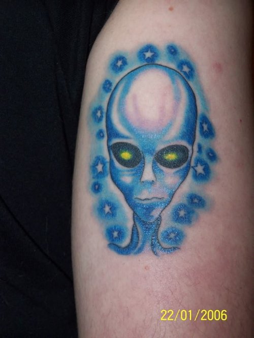 Blue Ink Alien Head Tattoo On Bicep