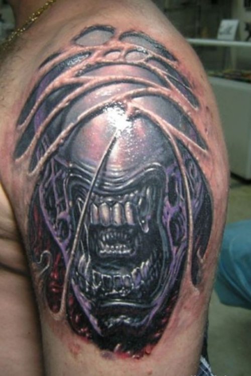 Ripped Skin Alien Tattoo On Man Left Shoulder