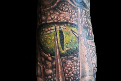 Alligator Eye Tattoo On Sleeve
