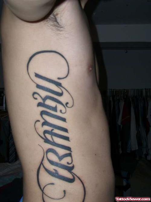 Ambigram Tattoo On Side Rib
