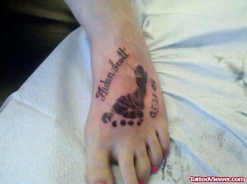 Aiden Scott Ambigram And Footprint Tattoo