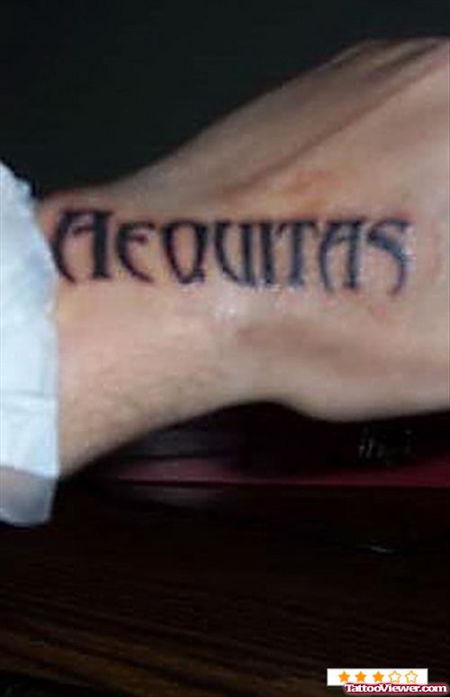 Aequitas Ambigram Tattoo On Left Hand