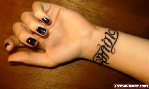 Pain Ambigram Tattoo On Girl Wrist