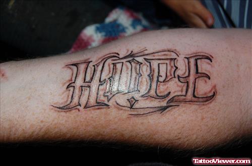 Grey Ink Hope Ambigram Tattoo On Arm