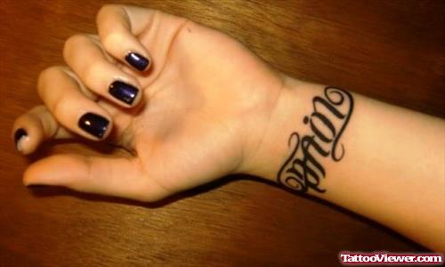 Pain Ambigram Tattoo On Wrist